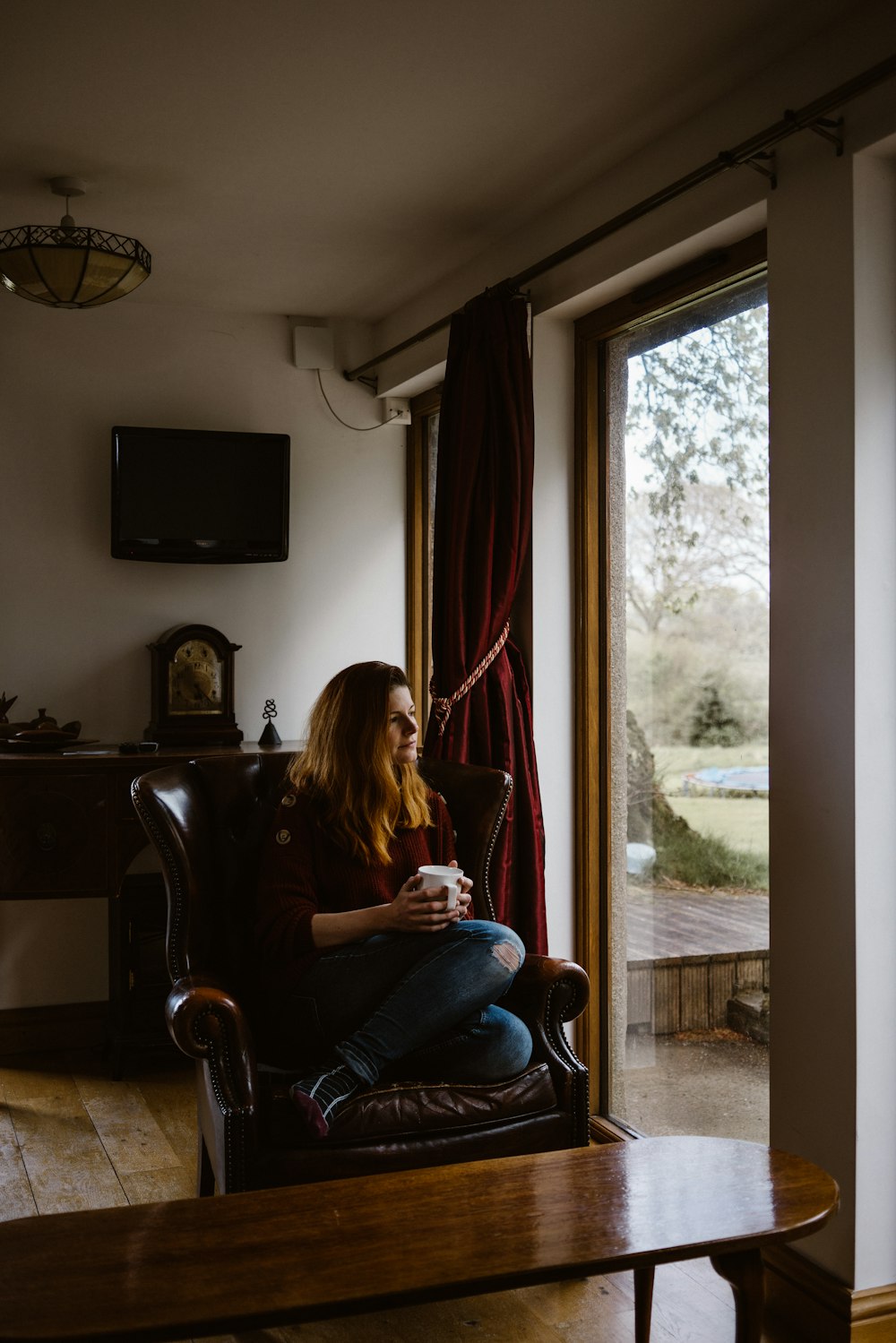 woman sitting on sofa chair