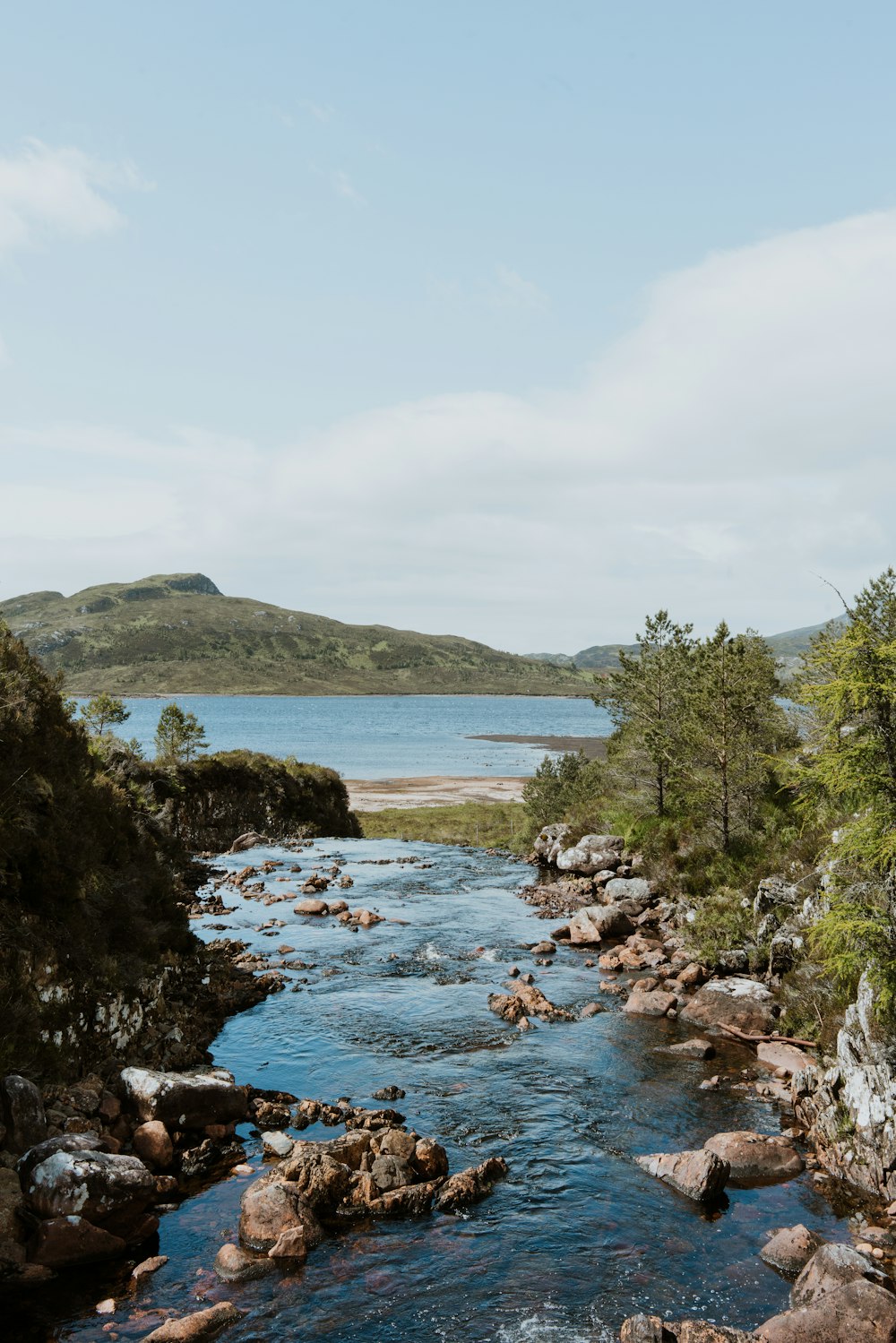 body of water surrounded by mountains