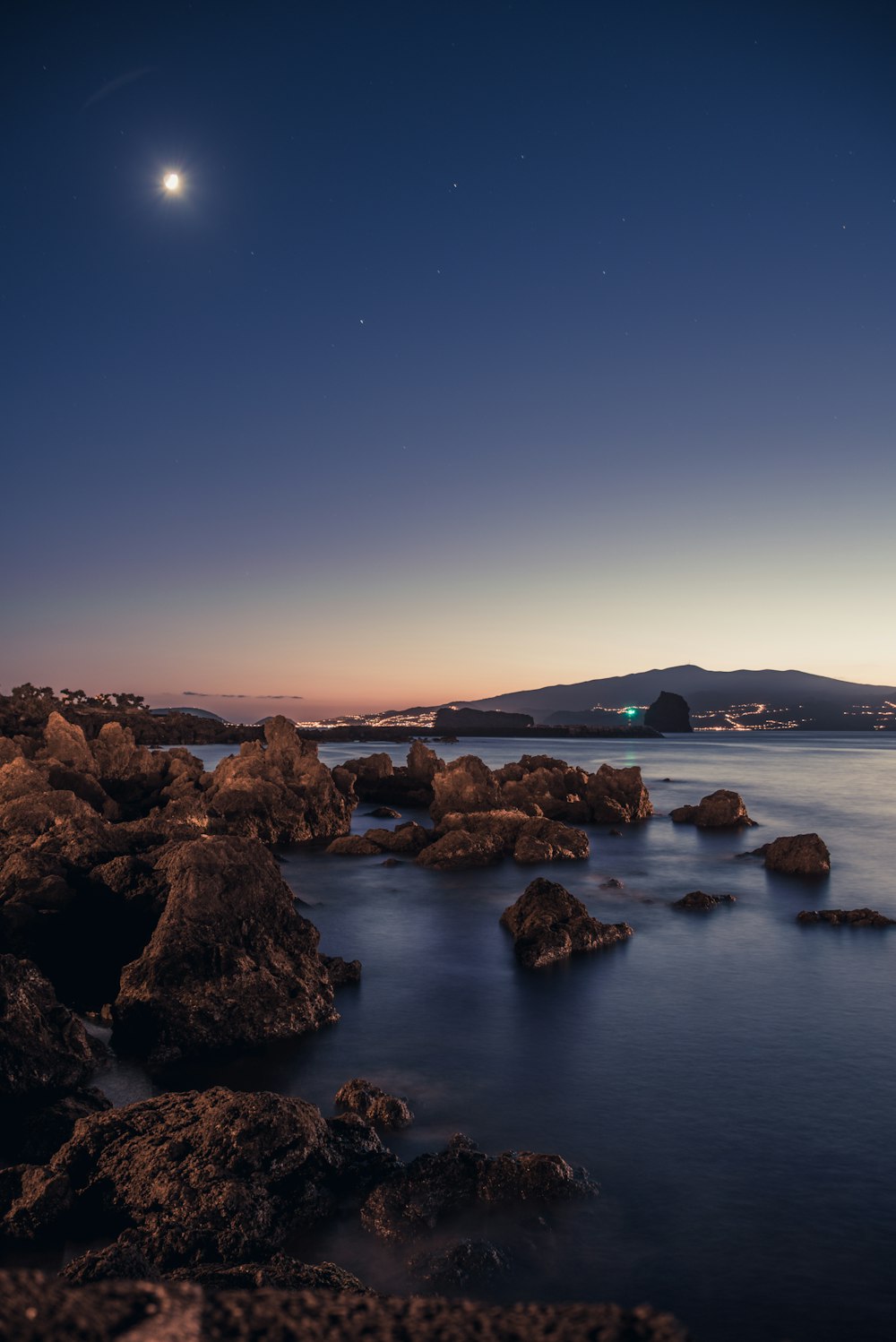 calm sea under clear blue sky