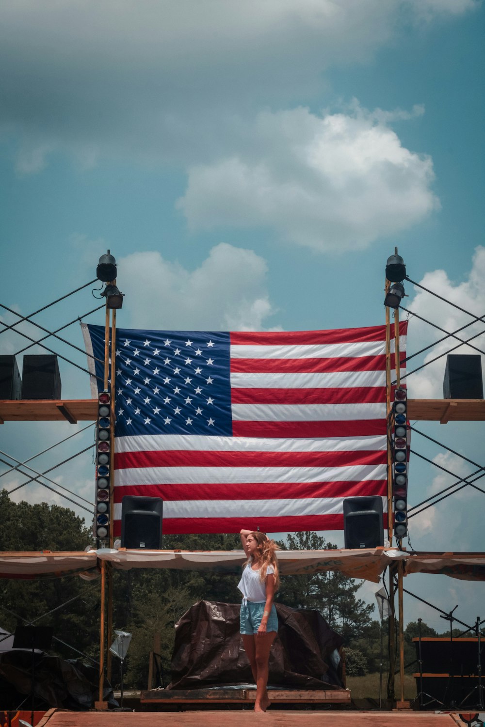 woman standing in front of U.S.A. flag