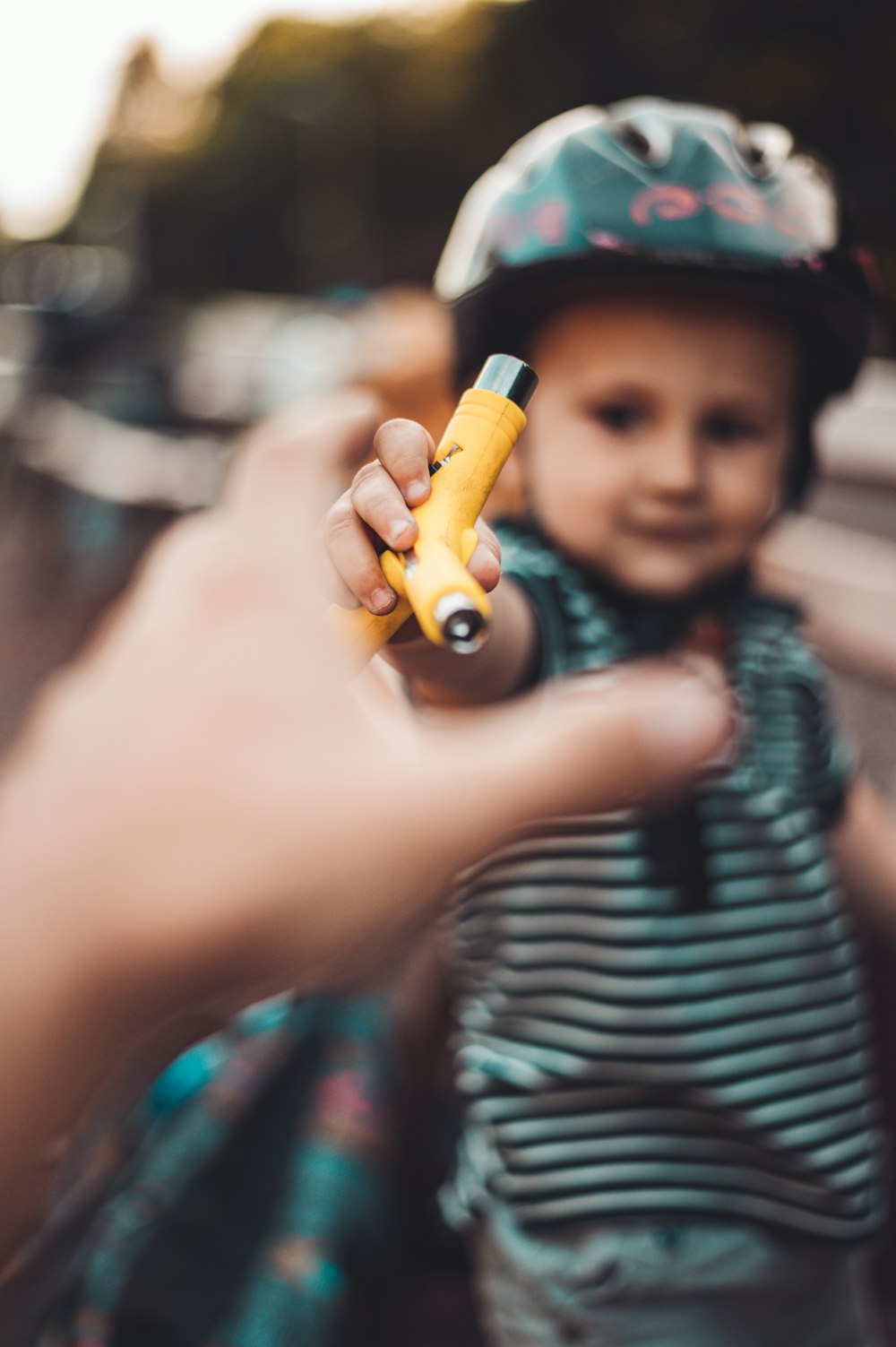 boy holding orange inhaler