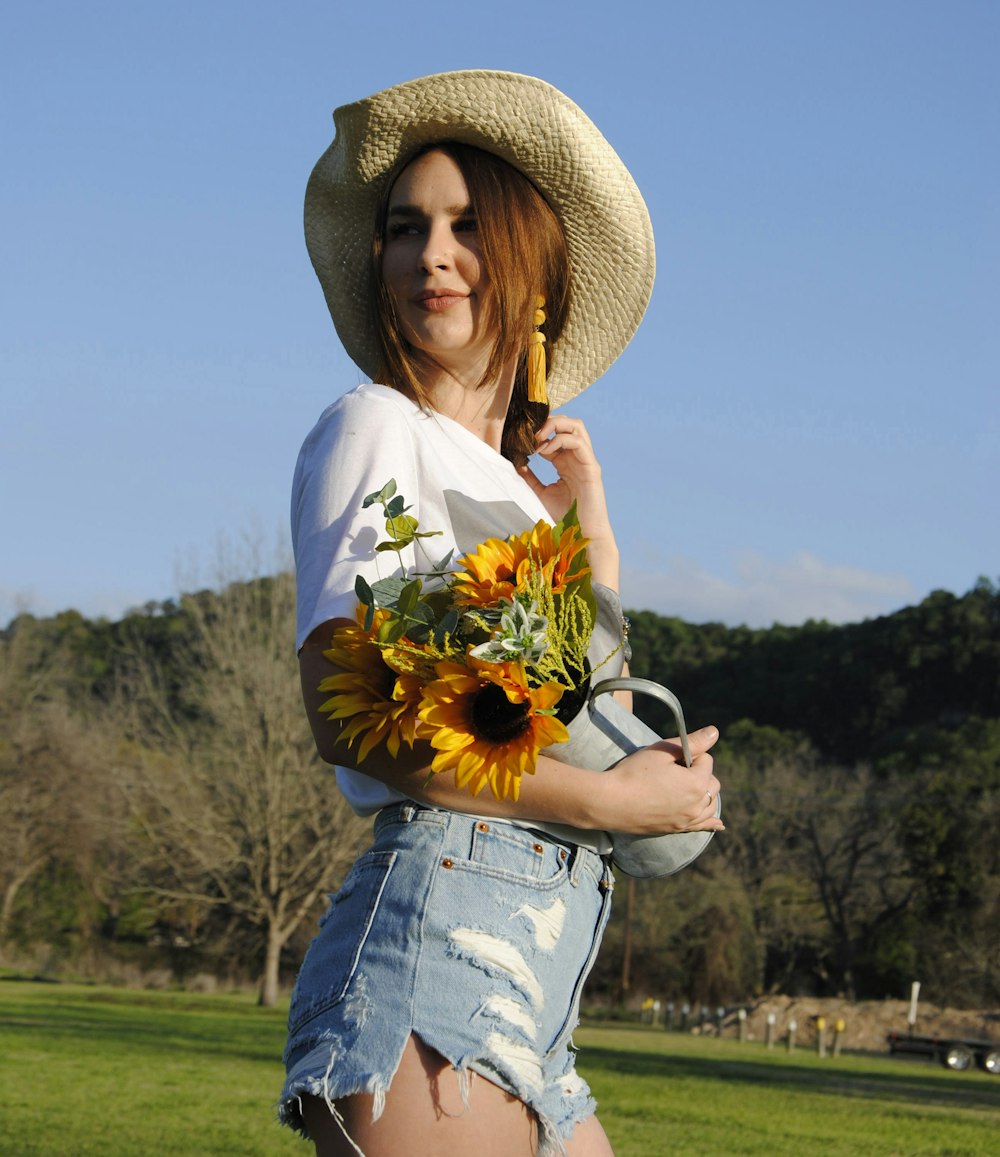 woman holding sunflowers