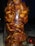 A clear glass jar filled with tightly packed dates, showcasing their rich, brown color and slightly glossy texture. The arrangement creates a dense, organic appearance, with each date's wrinkled skin and natural shape visible through the glass.