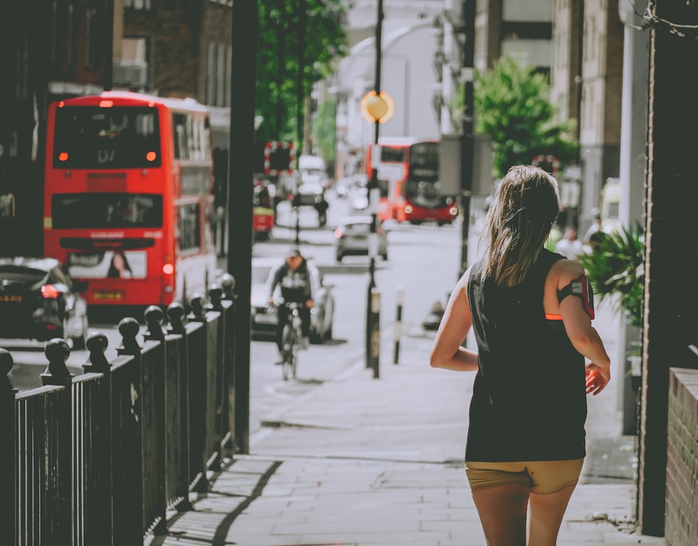 woman walking near buildign