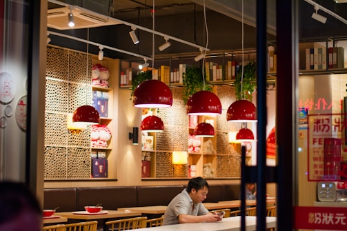 A cozy restaurant setting where customers place online food orders via a mobile app.