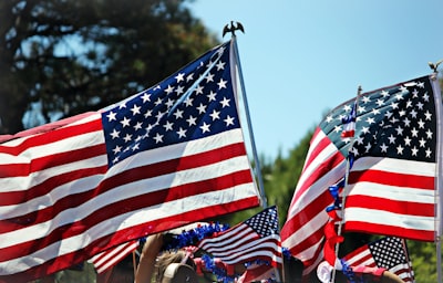 shallow focus photo of flag of usa 4th of july teams background