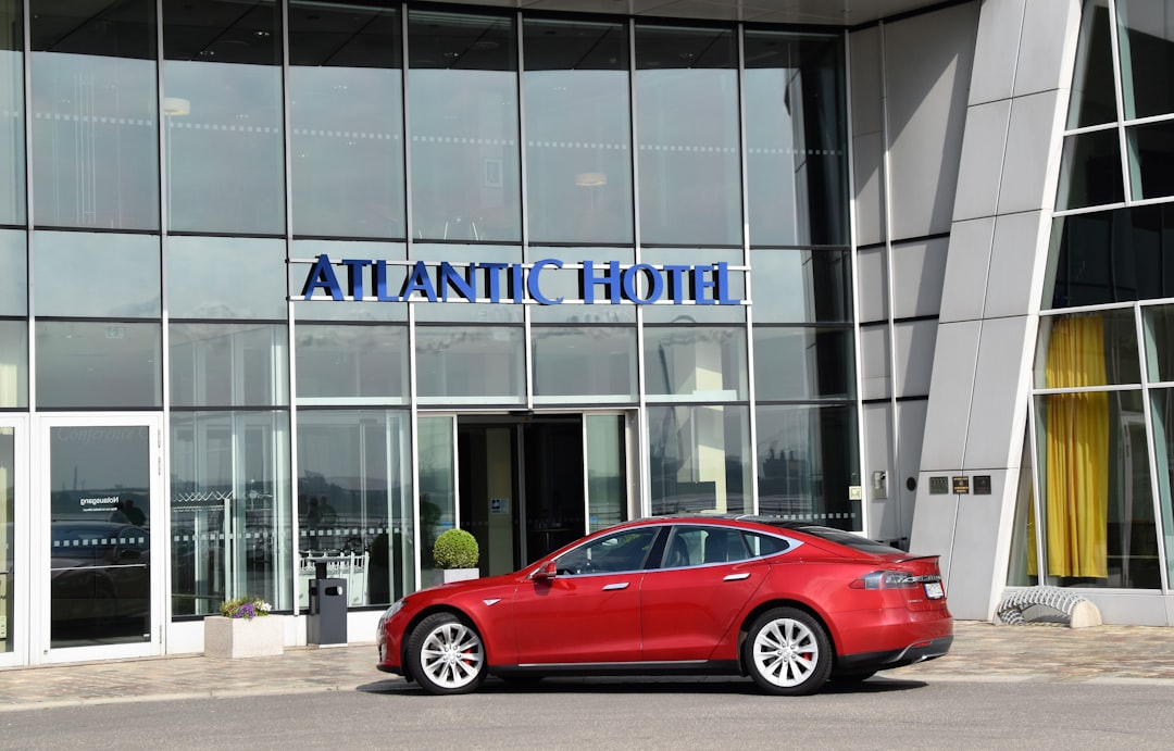 red sedan outside Atlantic Hotel