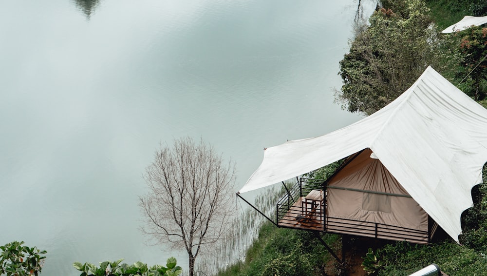 brown house near the lake