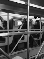 Passengers relaxing inside Raj Express, enjoying onboard amenities.