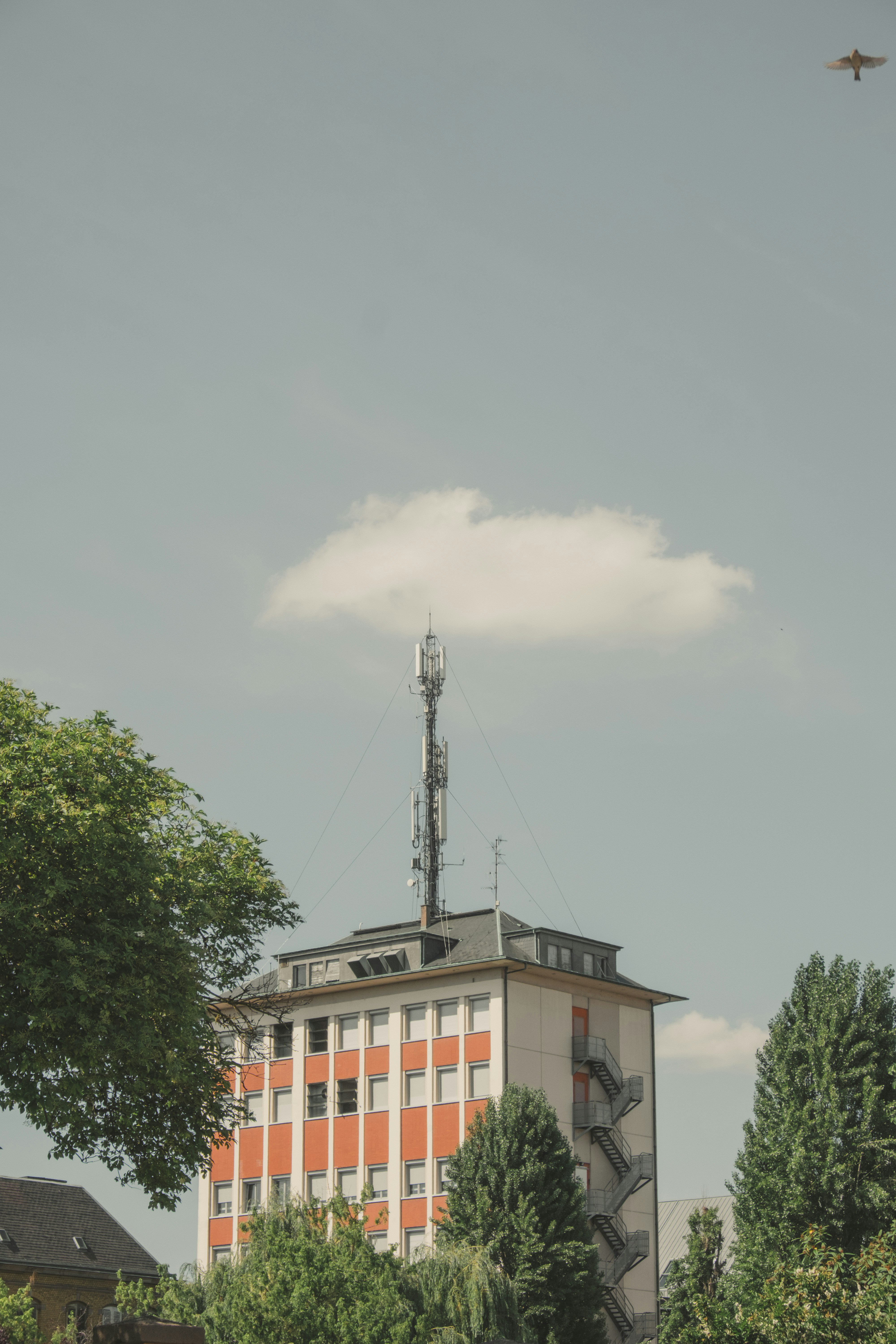 white and brown building with satellite