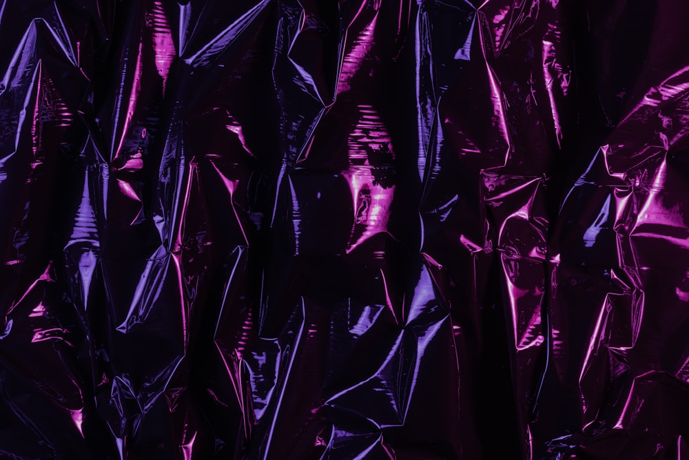 a large amount of shiny purple plastic bags