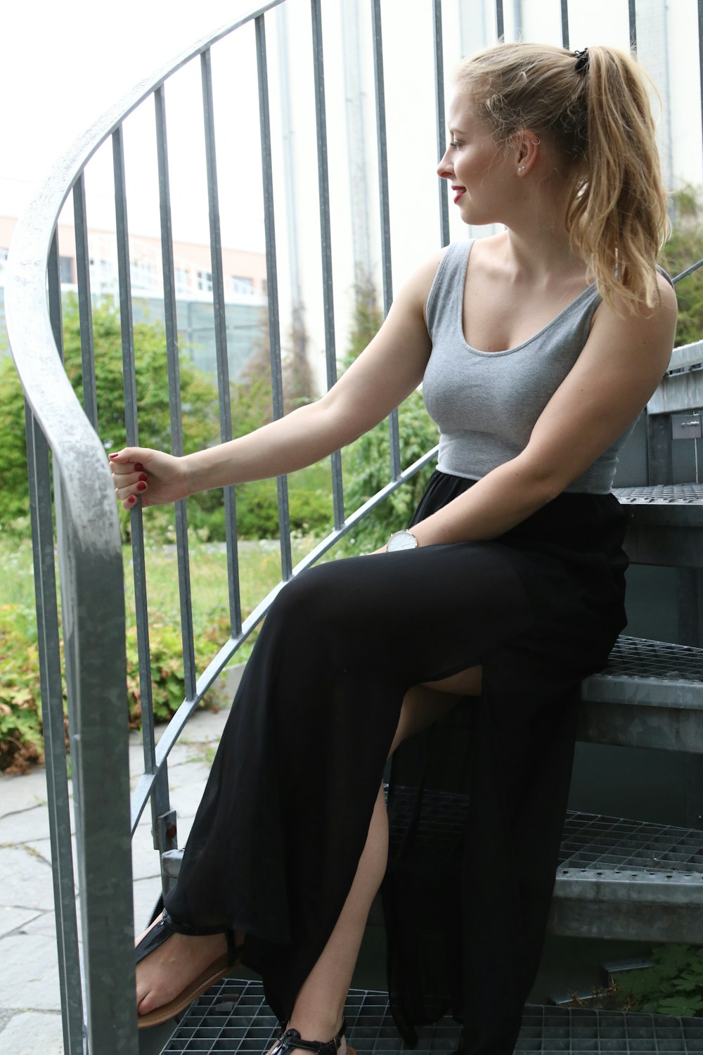 women sitting in a stair during daytime