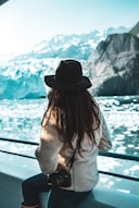 woman with a DLSR camera with icebergs