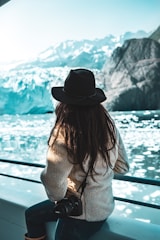woman with a DLSR camera with icebergs