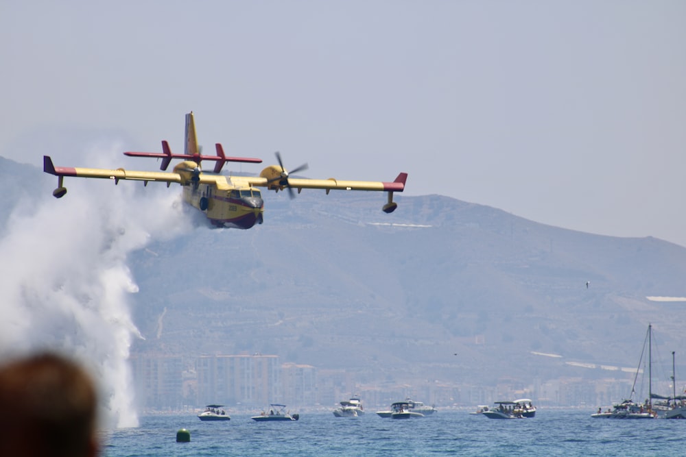 flying plane near mountain at daytime