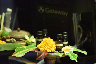 yellow flowers on brown wooden table