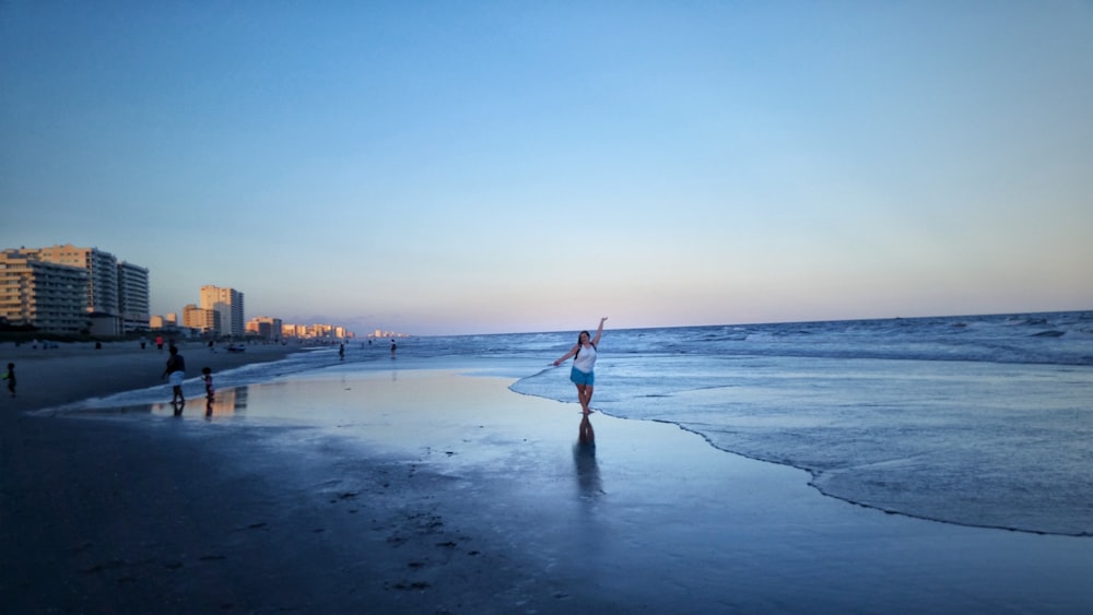 woman walking on seashore