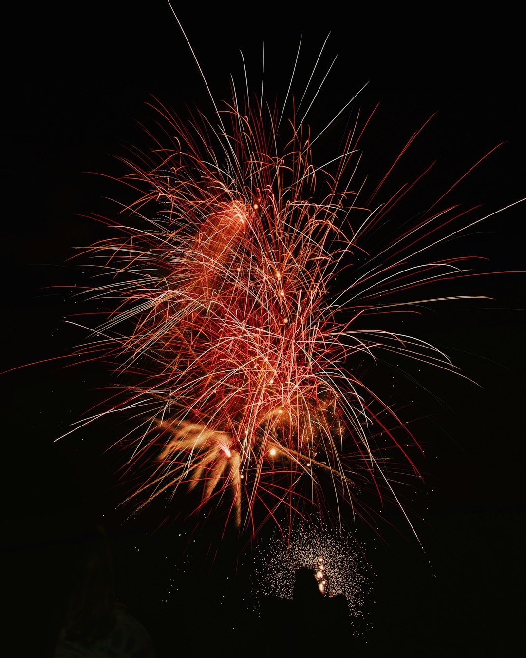 photography of red fireworks during nighttime