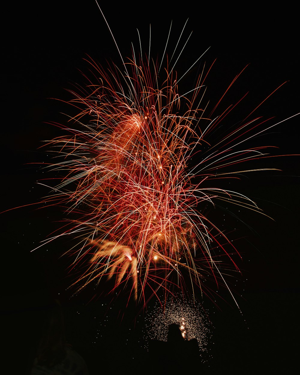 photography of red fireworks during nighttime