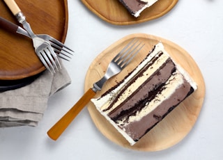 sliced cakes on round brown wooden plates