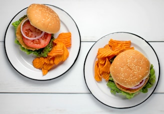 burger dish on round white ceramic plates