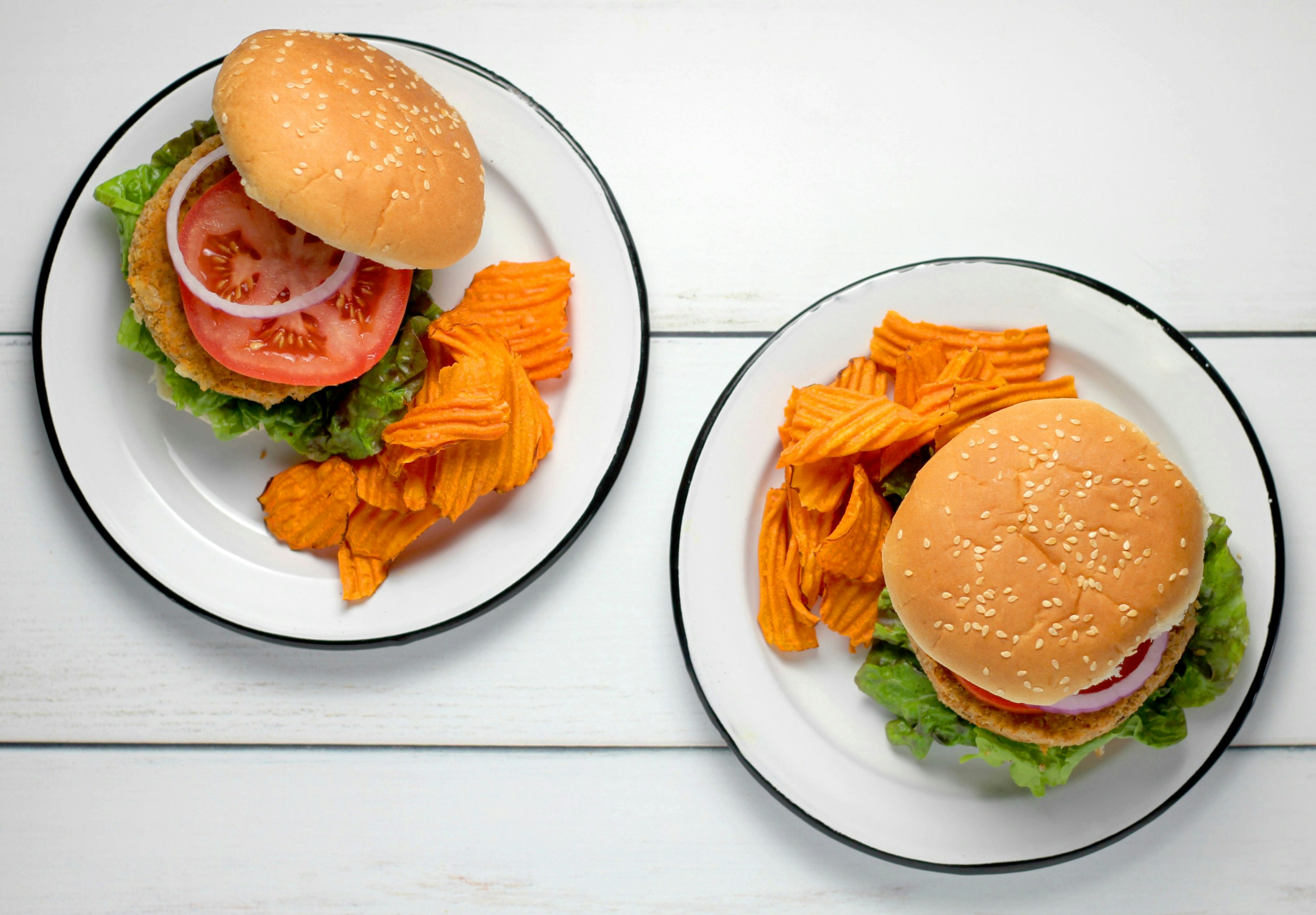 burger dish on round white ceramic plates