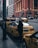 A busy city street scene with yellow taxis lined up.