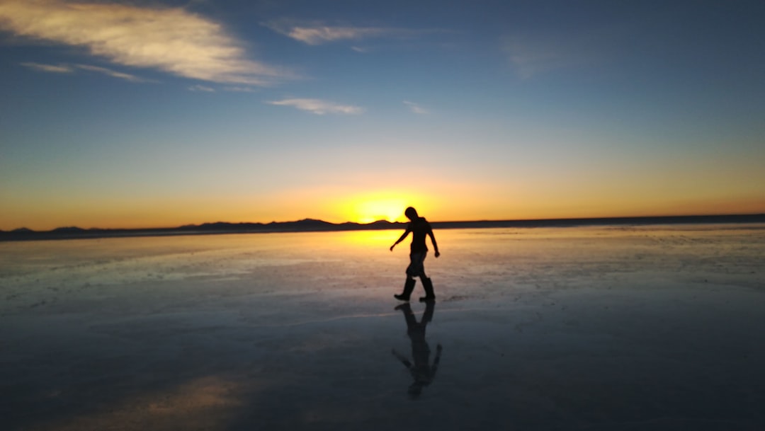 man walking on frozen water,