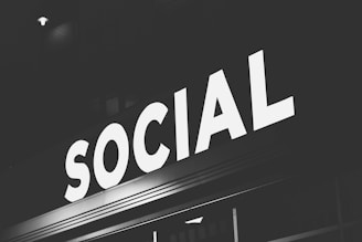 white Social signage at nighttime