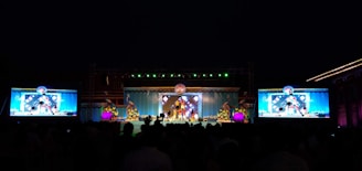 a group of people standing on top of a stage