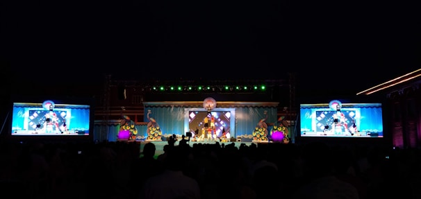 a group of people standing on top of a stage