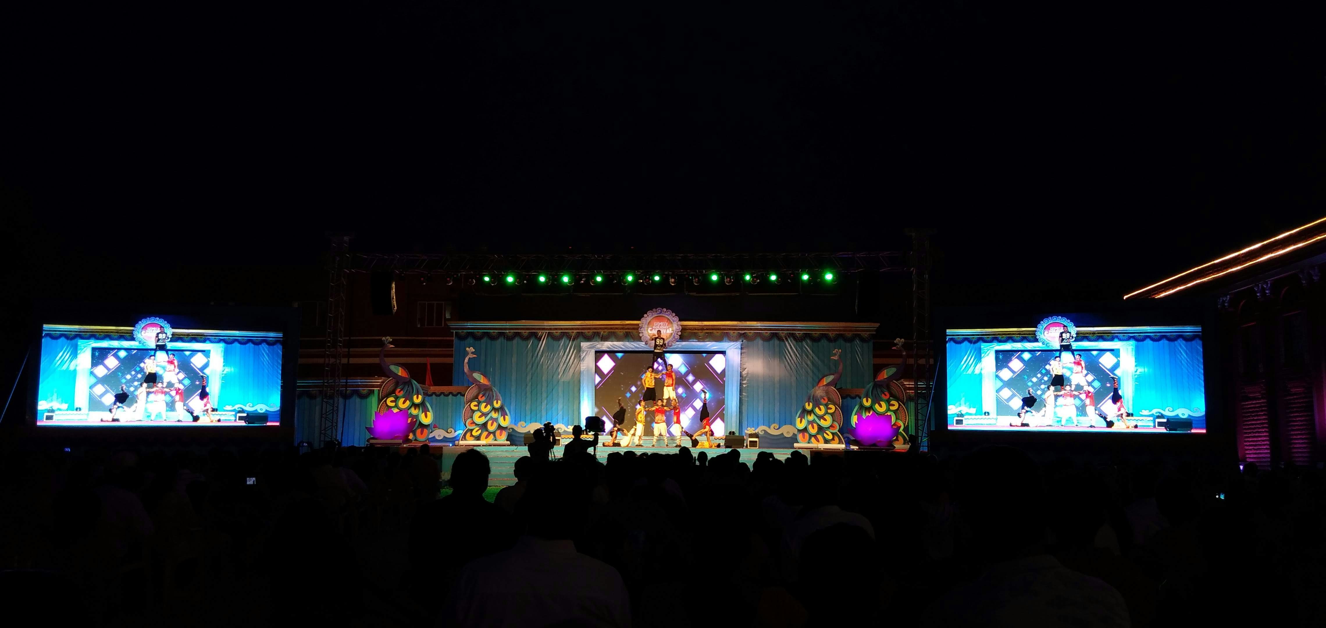 a group of people standing on top of a stage