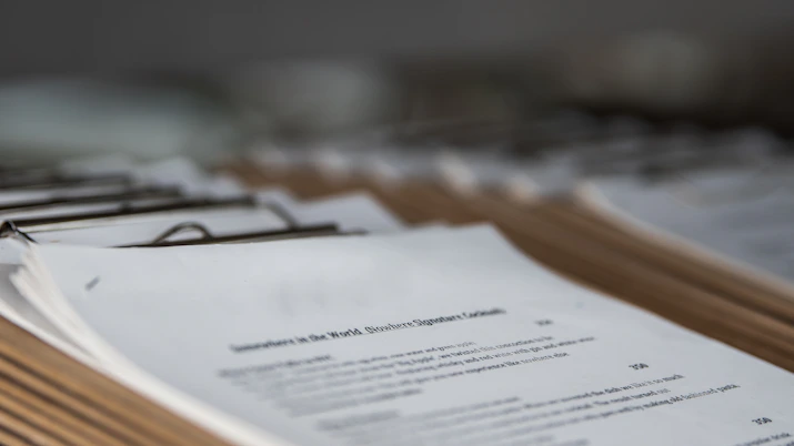 restaurant menus on clipboards close up