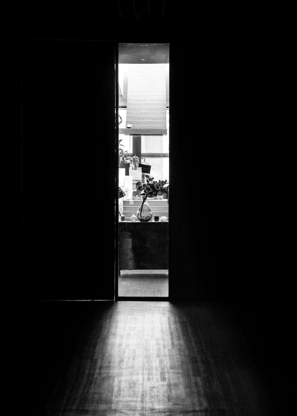 a black and white photo of an open door