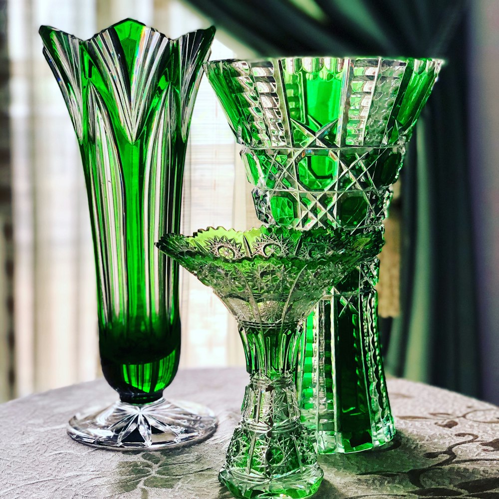 3 green glass vases
