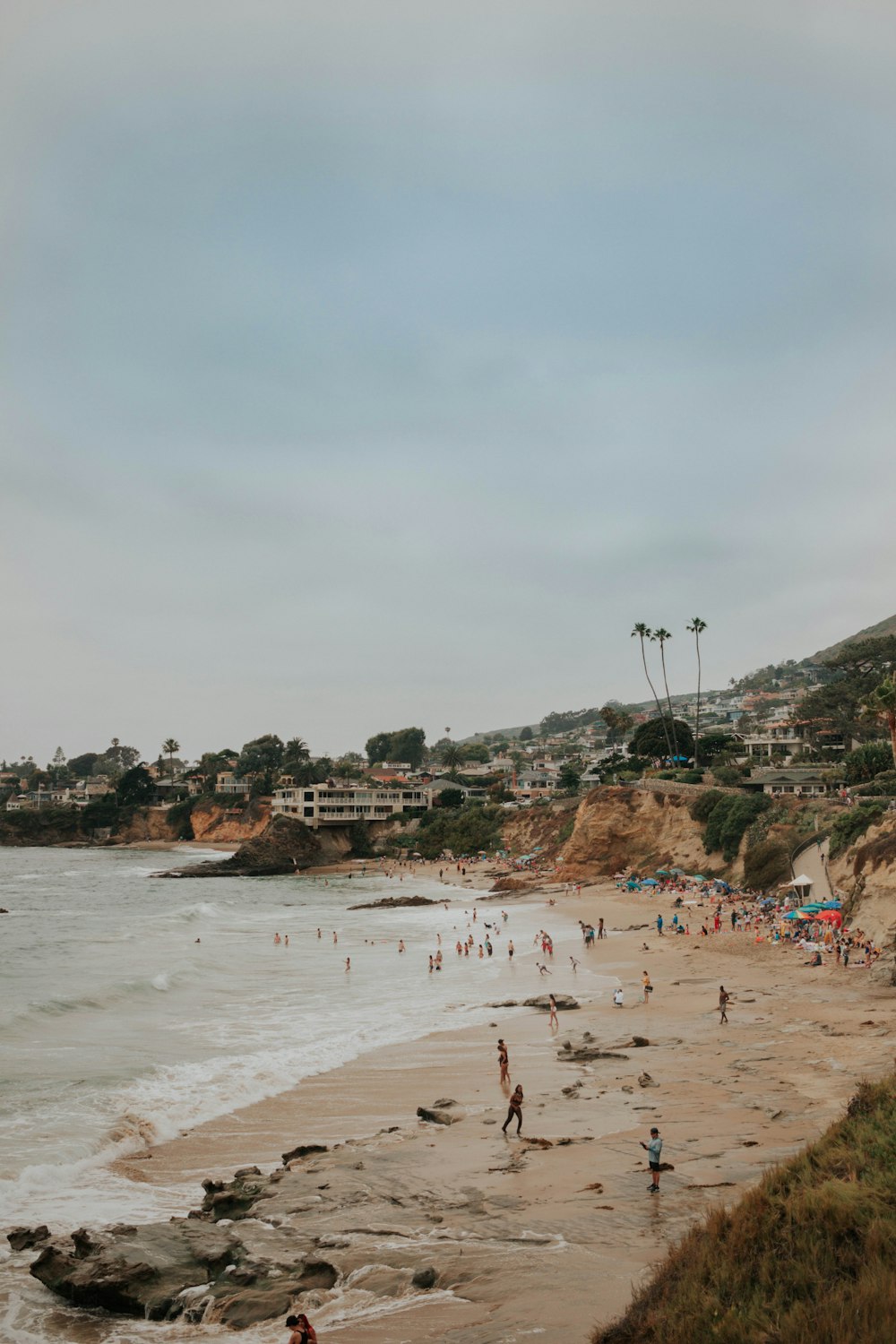 people walking on seashore