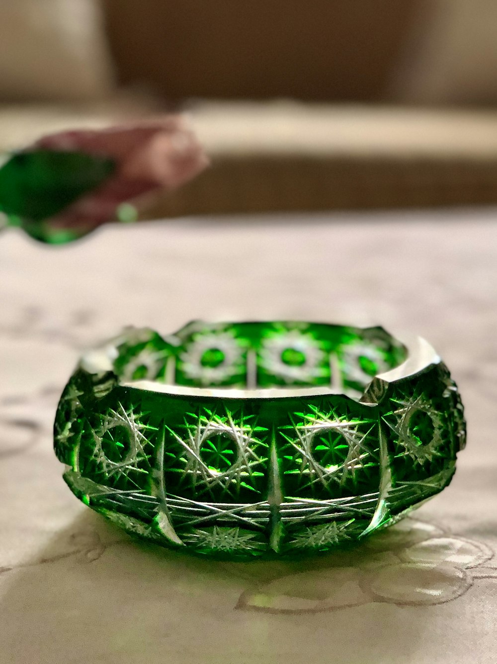 round green and white floral ashtray close-up photography