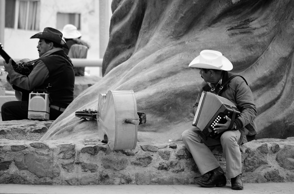 two men playing musical instruments