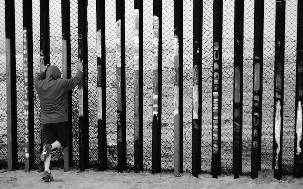 person standing beside wall