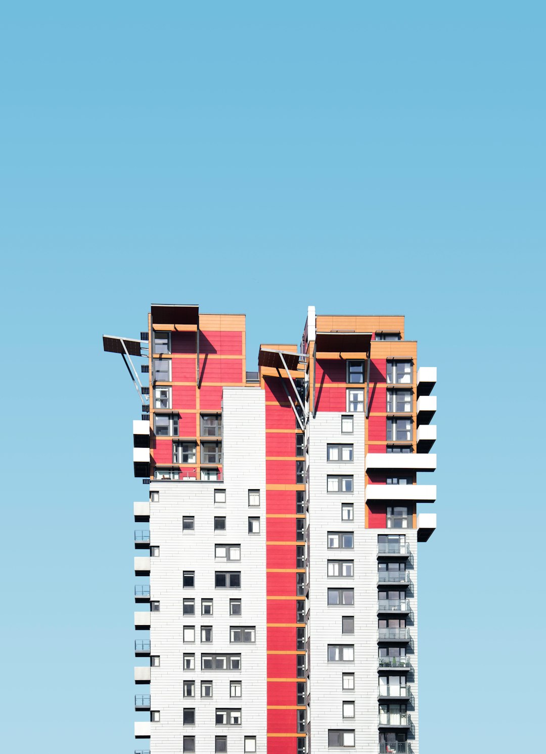 white and red high-rise building