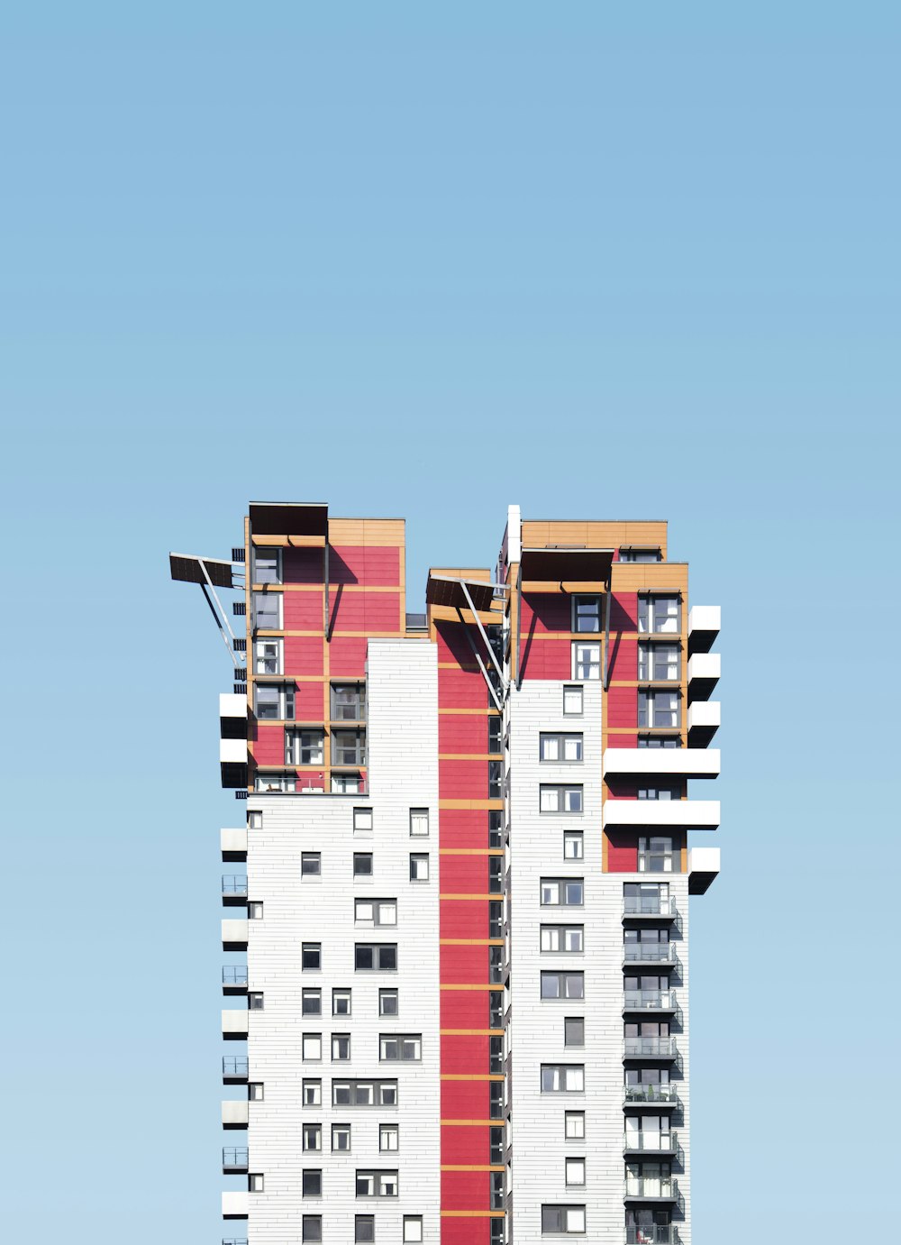 white and red high-rise building