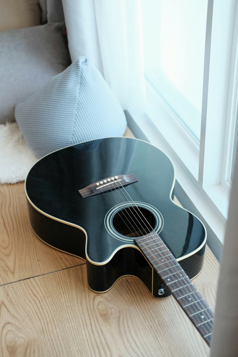 black cutaway acoustic guitar