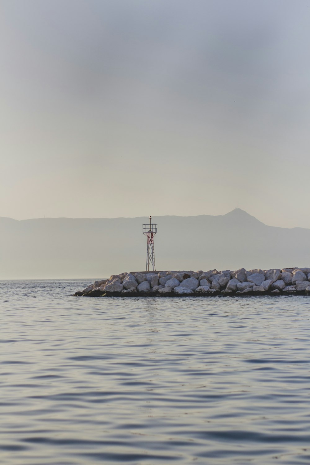 white tower near body of water