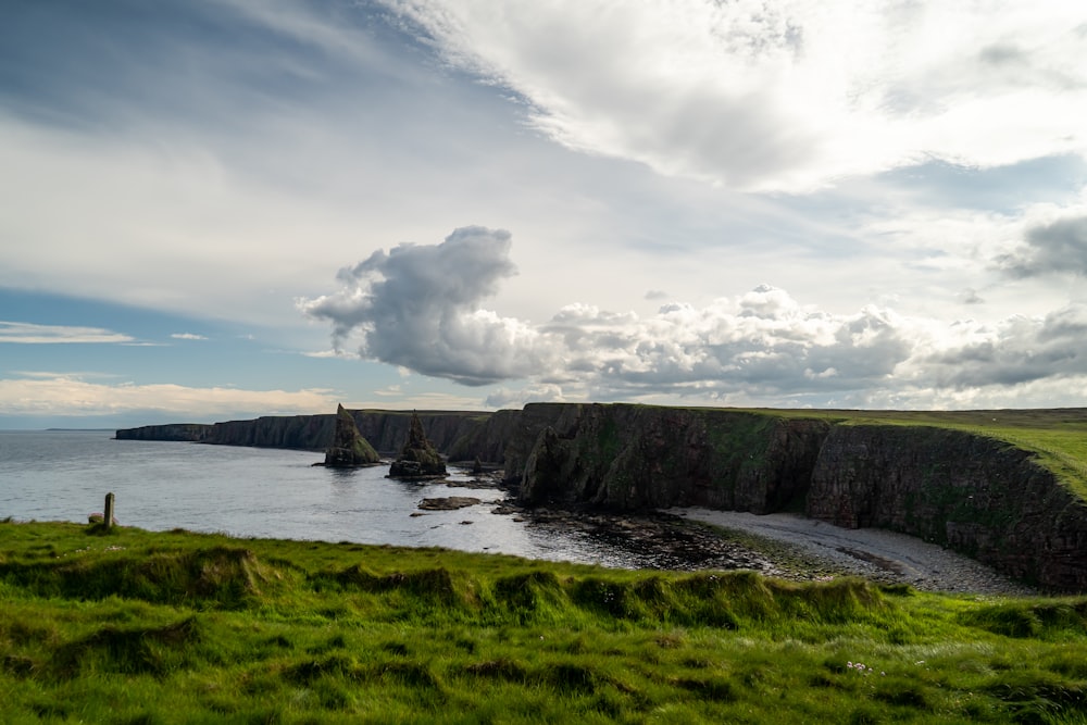 high-angle photography of beach under gray sky