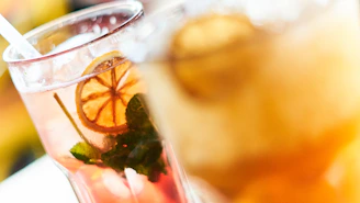 Close-up of refreshing drinks including water and energy drinks on a bar counter at the padel club.