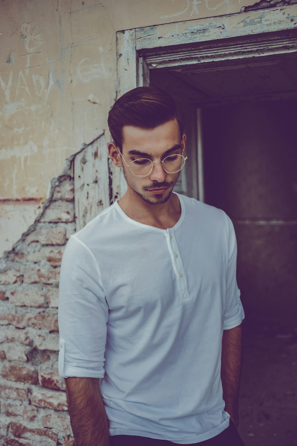 man wearing white henley shirt