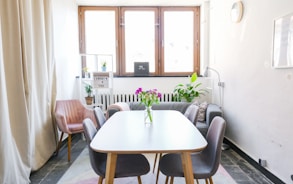 brown wooden table near wall