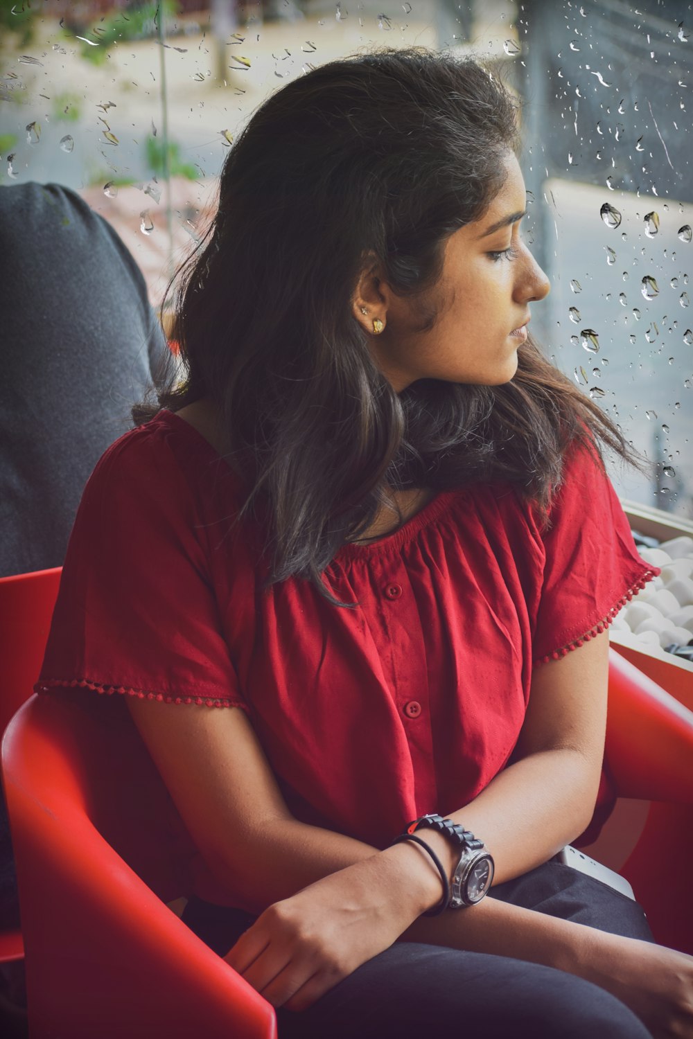 woman in red scoop-neck short-sleeved shirt