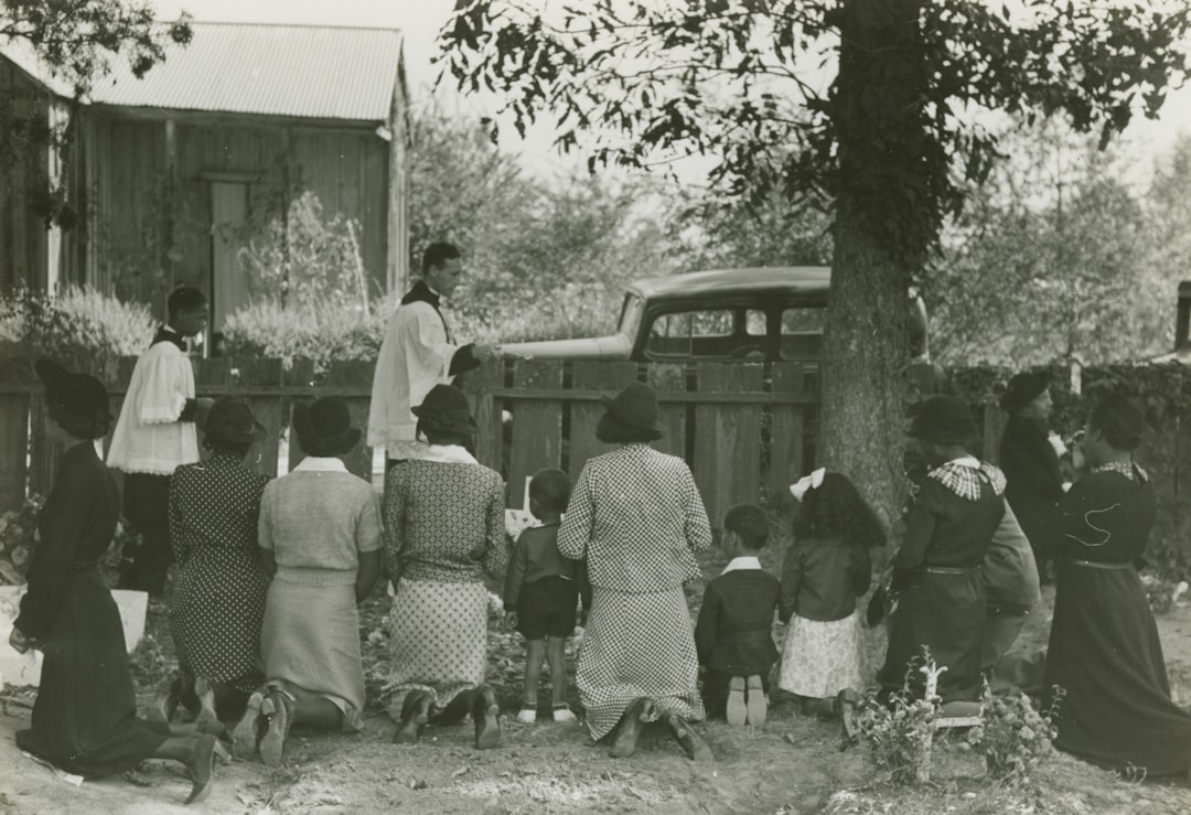 group of people kneeling near ree