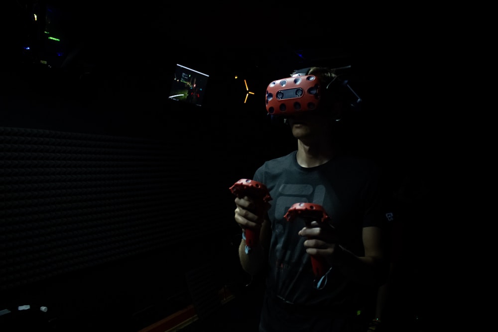 man wearing red virtual reality headset
